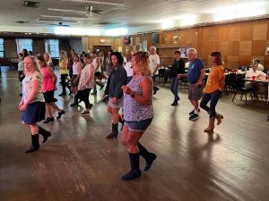 line dancing in Bristol Connecticut at the Bristol Polish American Citizens Club - large wooden dance floor - dancers